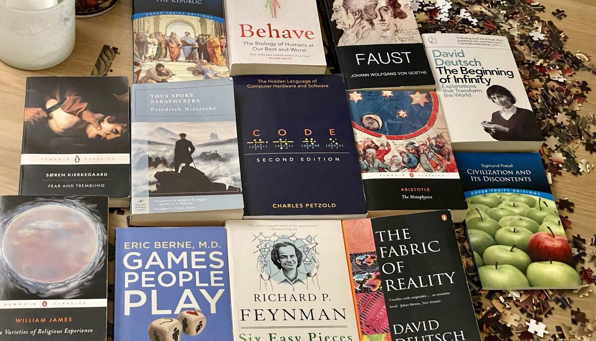 A spread of challenging books including Zarathustra, Behave, The Republic, and The Beginning of Infinity